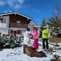 Building of a snowman with our apartment in the back (ground floor)